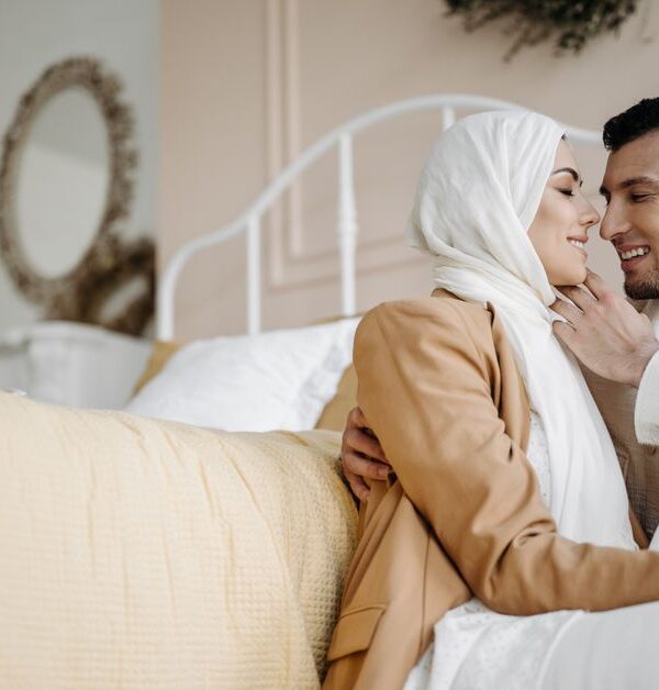A husband and wife share a tender, affectionate embrace, rekindling their love for each other.