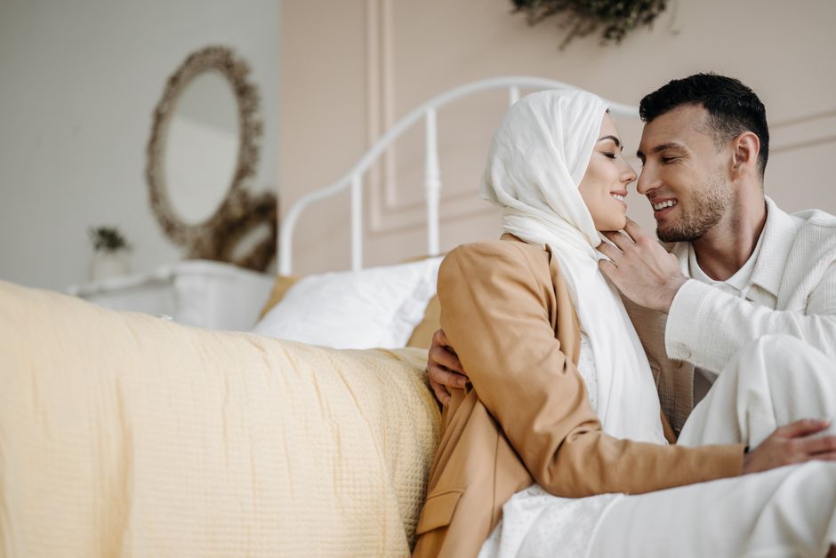 A husband and wife share a tender, affectionate embrace, rekindling their love for each other.