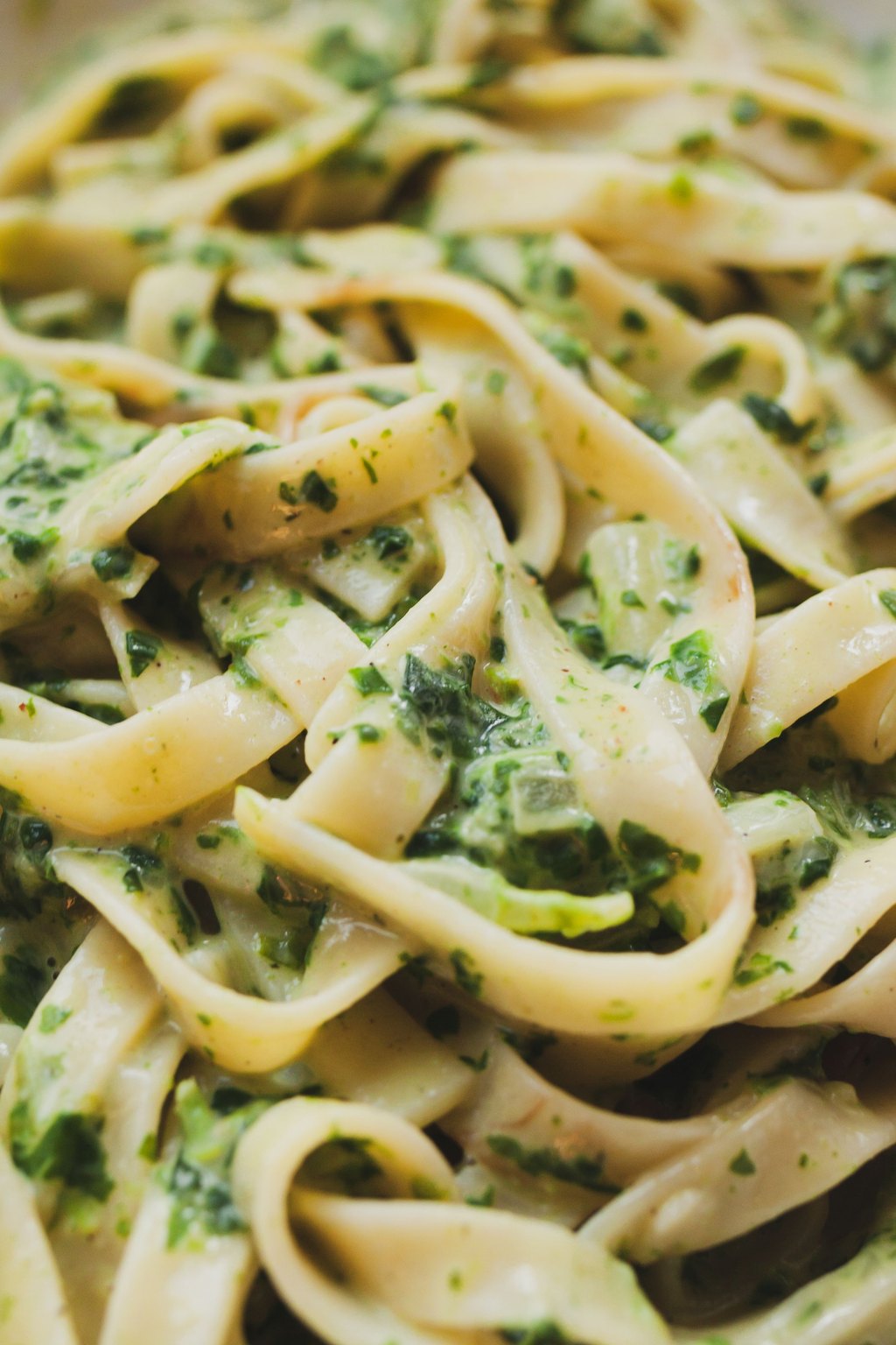 Close up of one pot spinach artichoke pasta