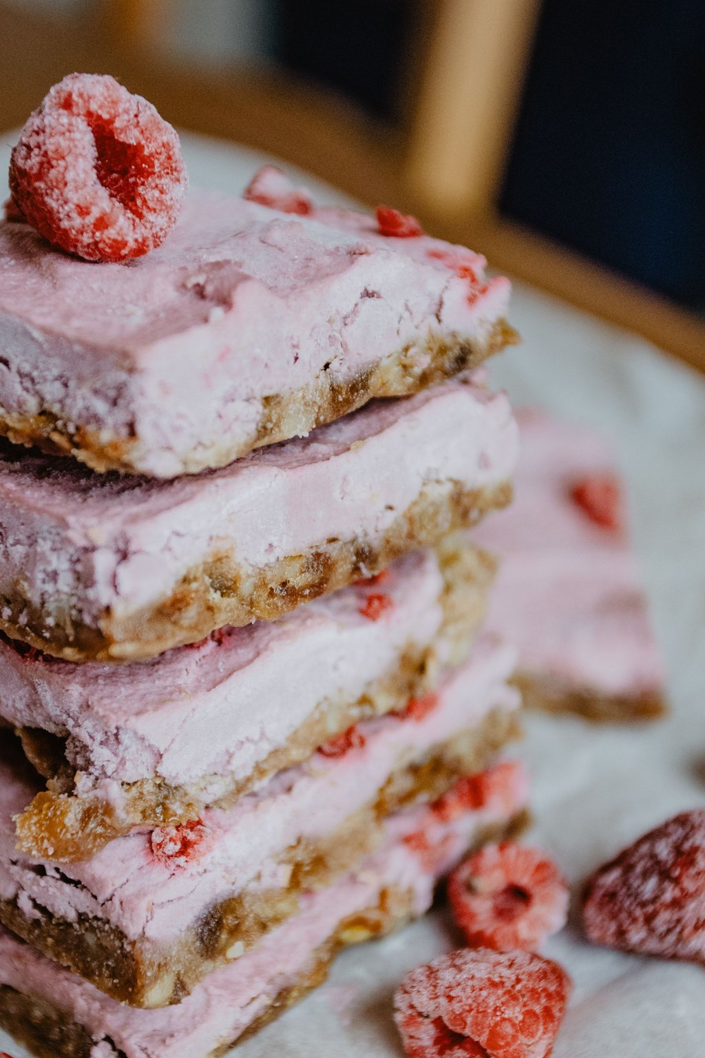 Close up of raspberry swirl cheesecake bars
