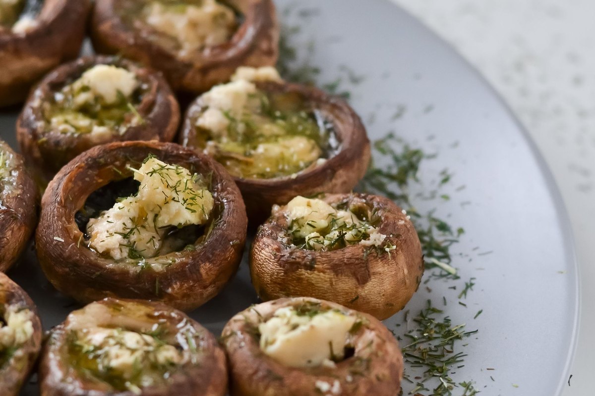 A serving of cream cheese stuffed mushrooms