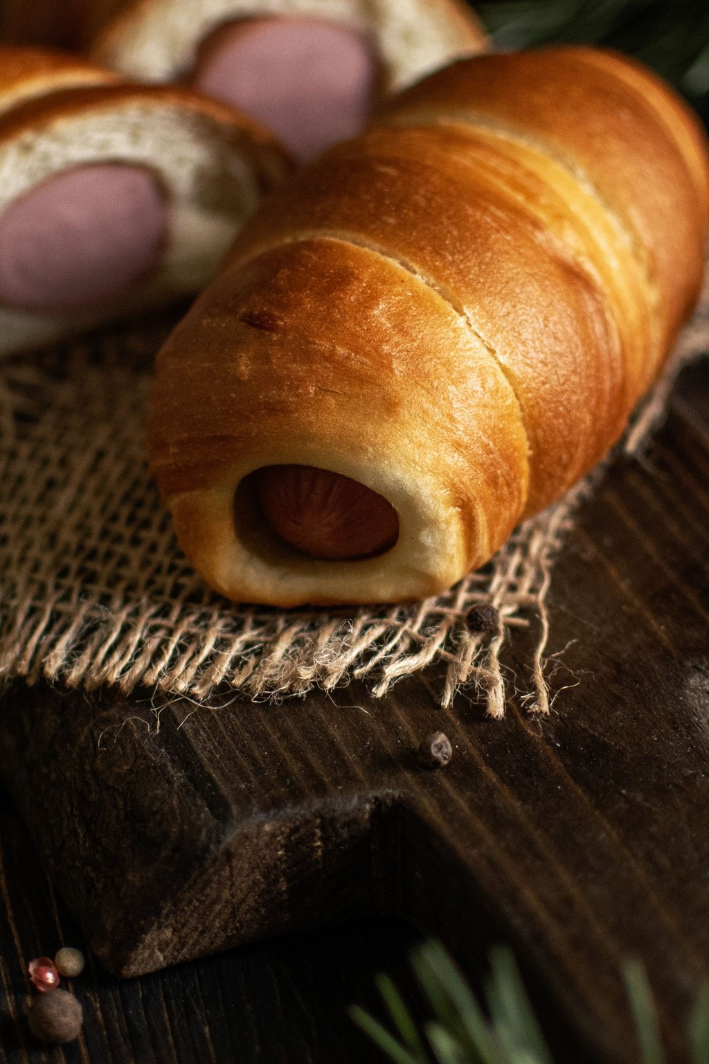 Close up of pigs in a blanket with honey mustard