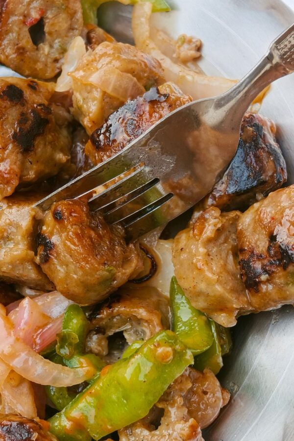 Close up of sheet pan sausage with butternut squash and apples