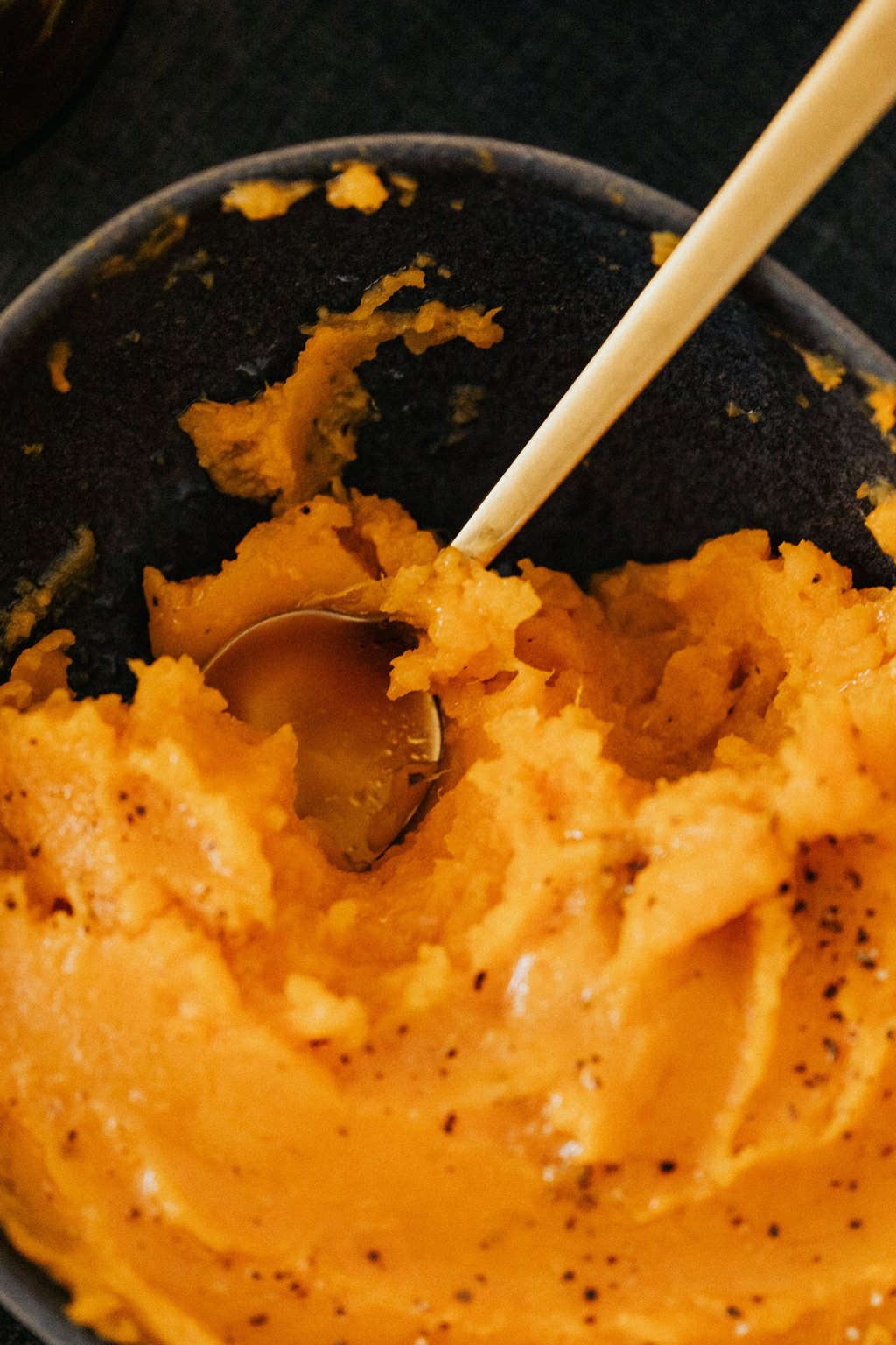 Close up of sweet potato casserole with pecan topping