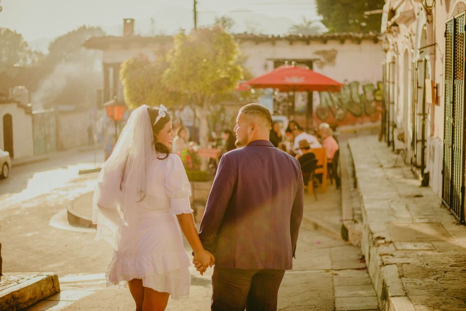 A married couple walking together hand in hand, symbolizing the commitment and partnership that comes with lasting marriage advice.