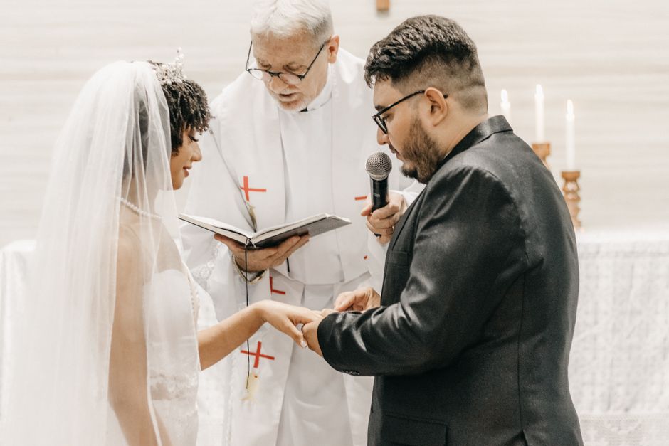 A bride and groom exchange wedding vows and rings at the altar, a moment that comes before the real work of marriage begins.