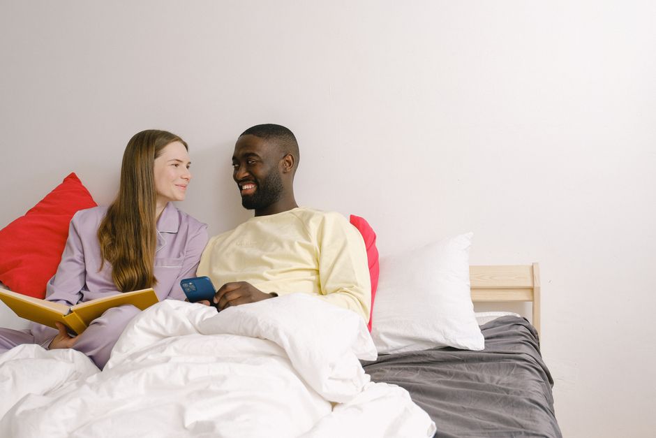 A couple shares a private, intimate moment together in bed, reflecting an old-fashioned marriage habit of keeping some things just between the two of you.
