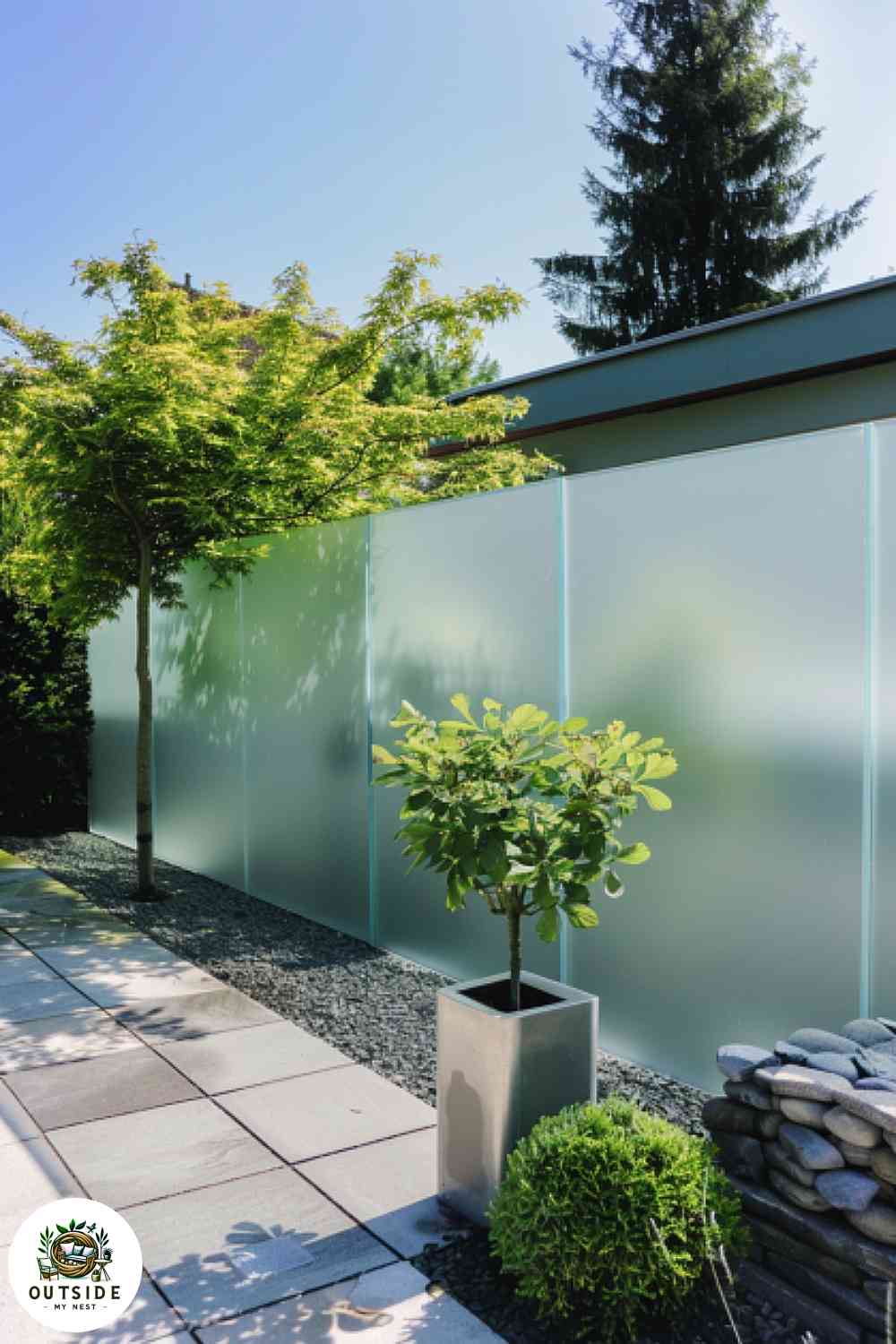 Frosted glass fence in minimalist yard
