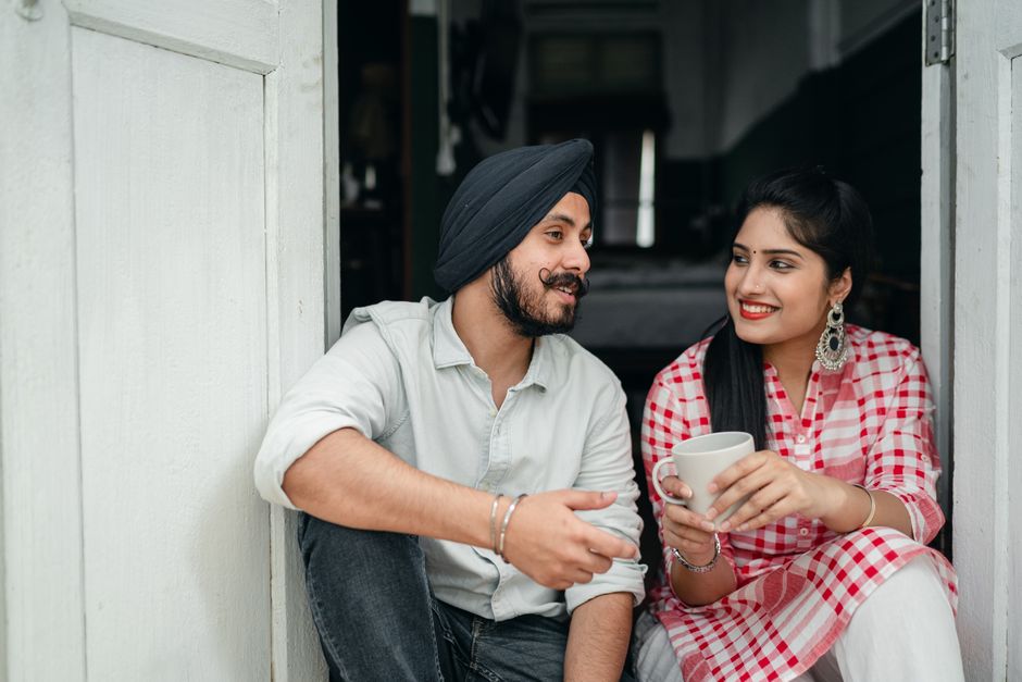 A husband and wife share coffee and genuine conversation, really listening to each other.