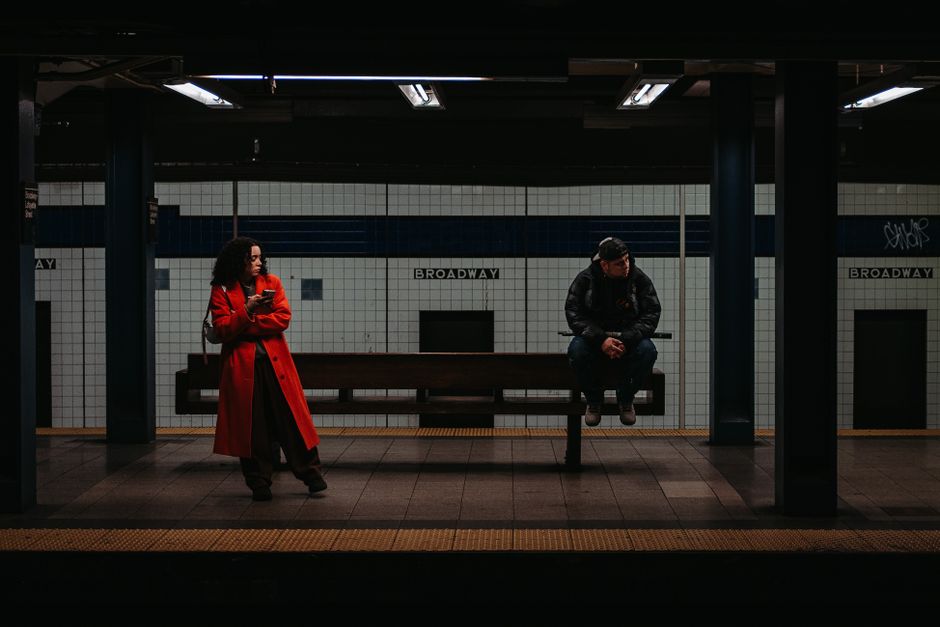 A man and woman cross paths at the same subway platform again, a subtle sign he keeps finding reasons to be around.