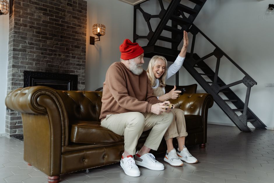 A mature couple enjoying a playful moment together at home, reflecting the closeness that comes from truly knowing your partner.