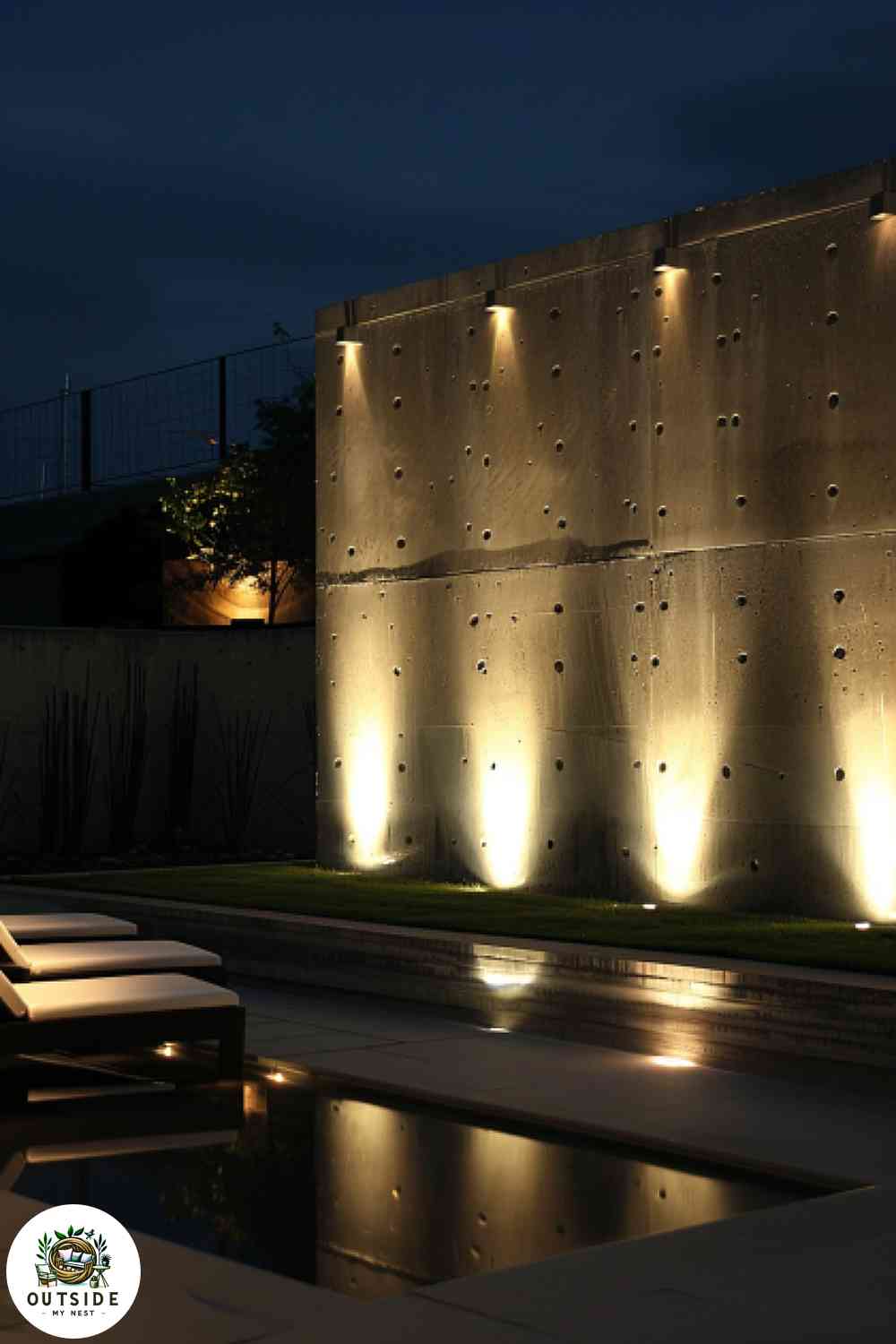 Recessed wall lighting on a modern concrete patio wall