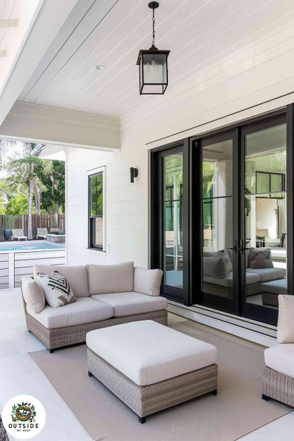 Sleek minimalist back porch with a neutral palette and clean lines