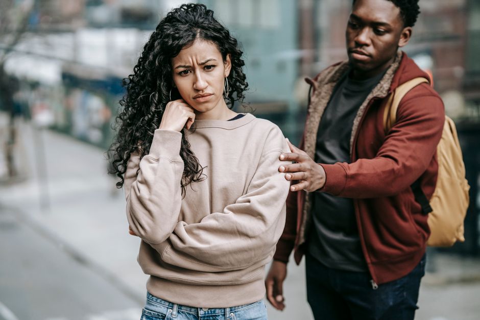 A man offers quiet comfort and kindness to a troubled woman during a difficult moment.
