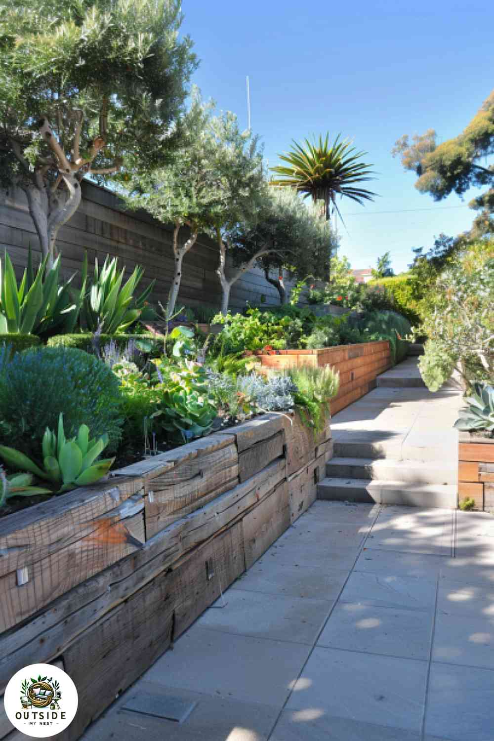 Wood timber retaining wall with garden beds.